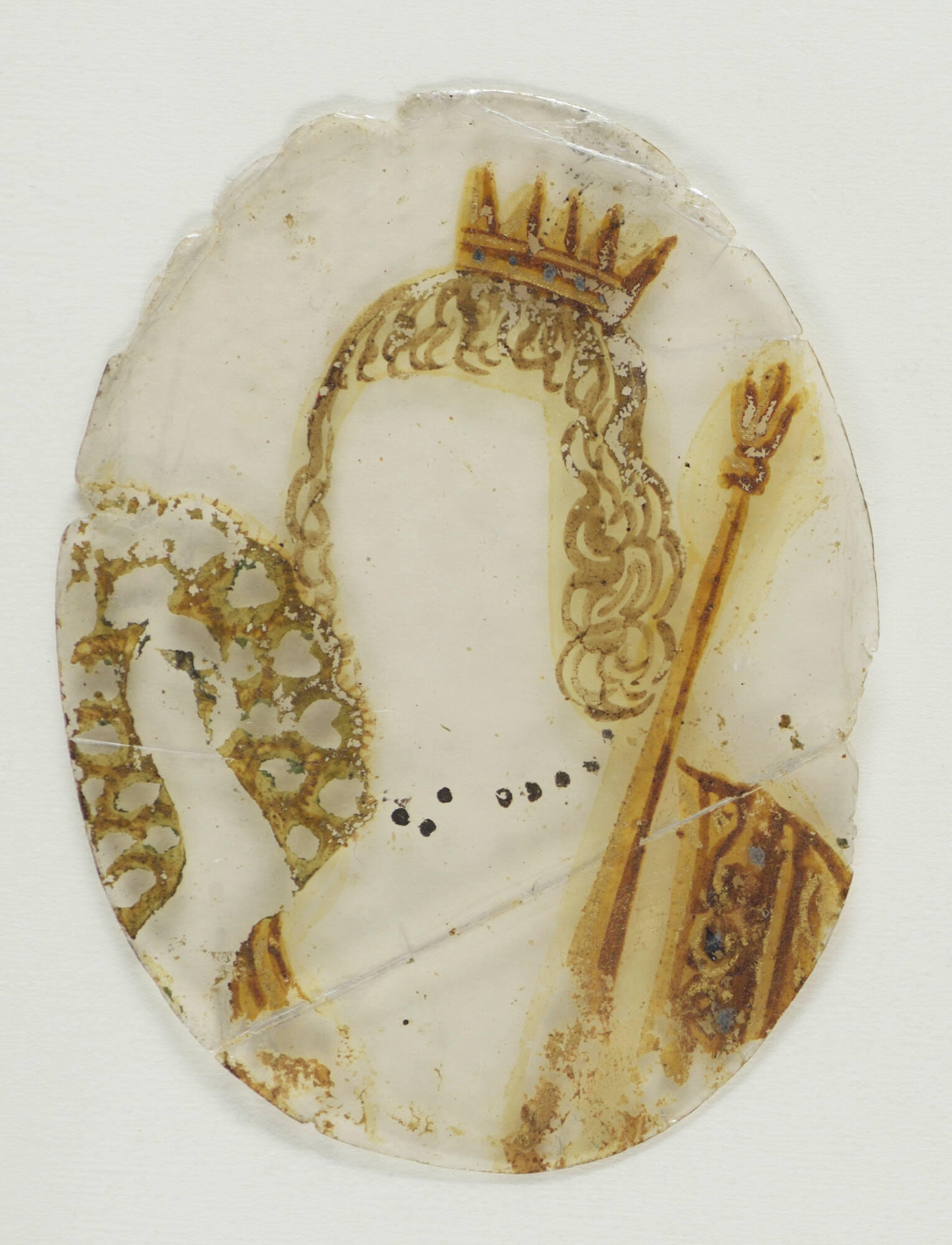 A transparent oval painted with shoulder length hair, a crown, a scepter, a dress, and necklace.