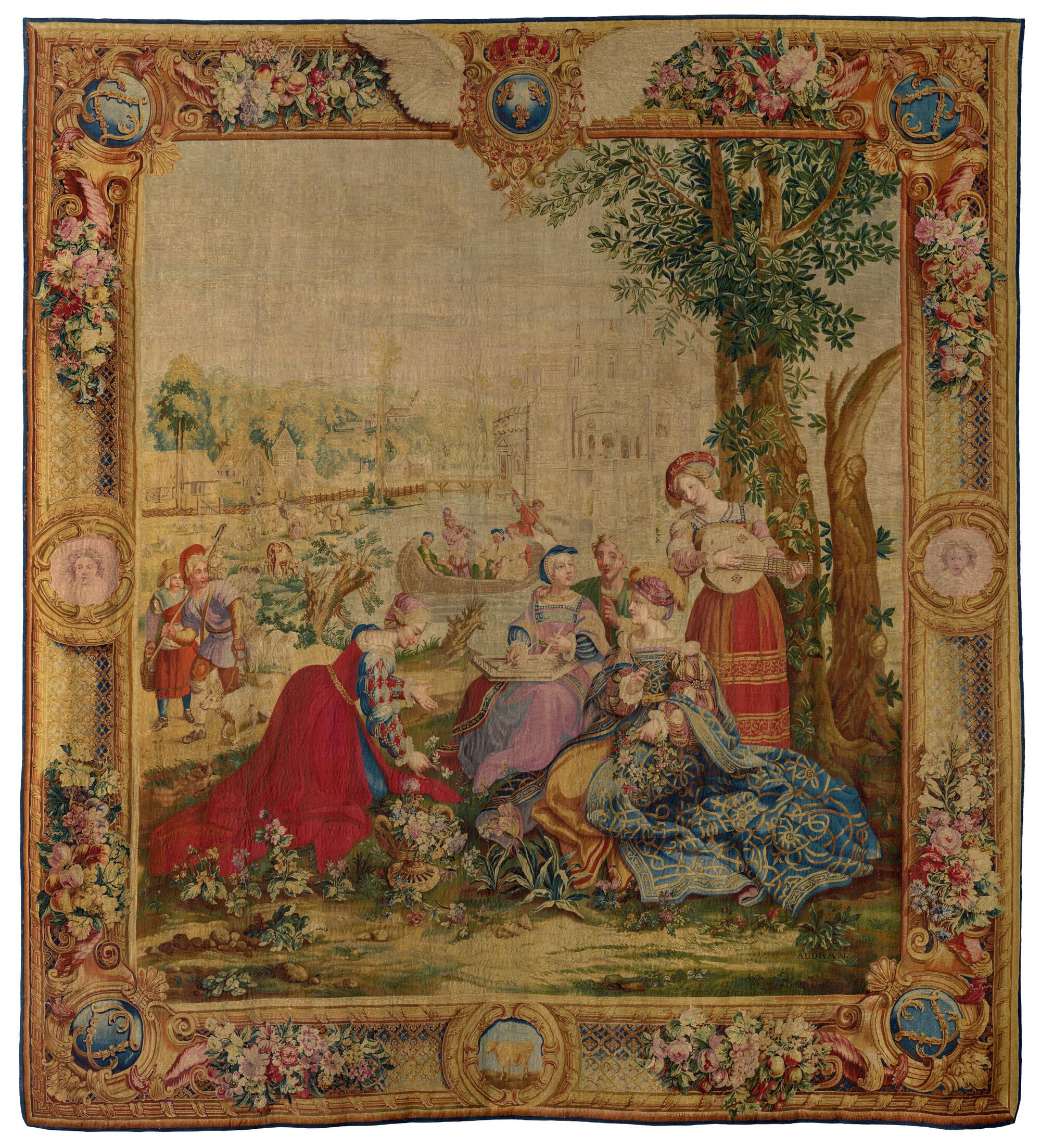 A tapestry with figures in a pleasure garden.