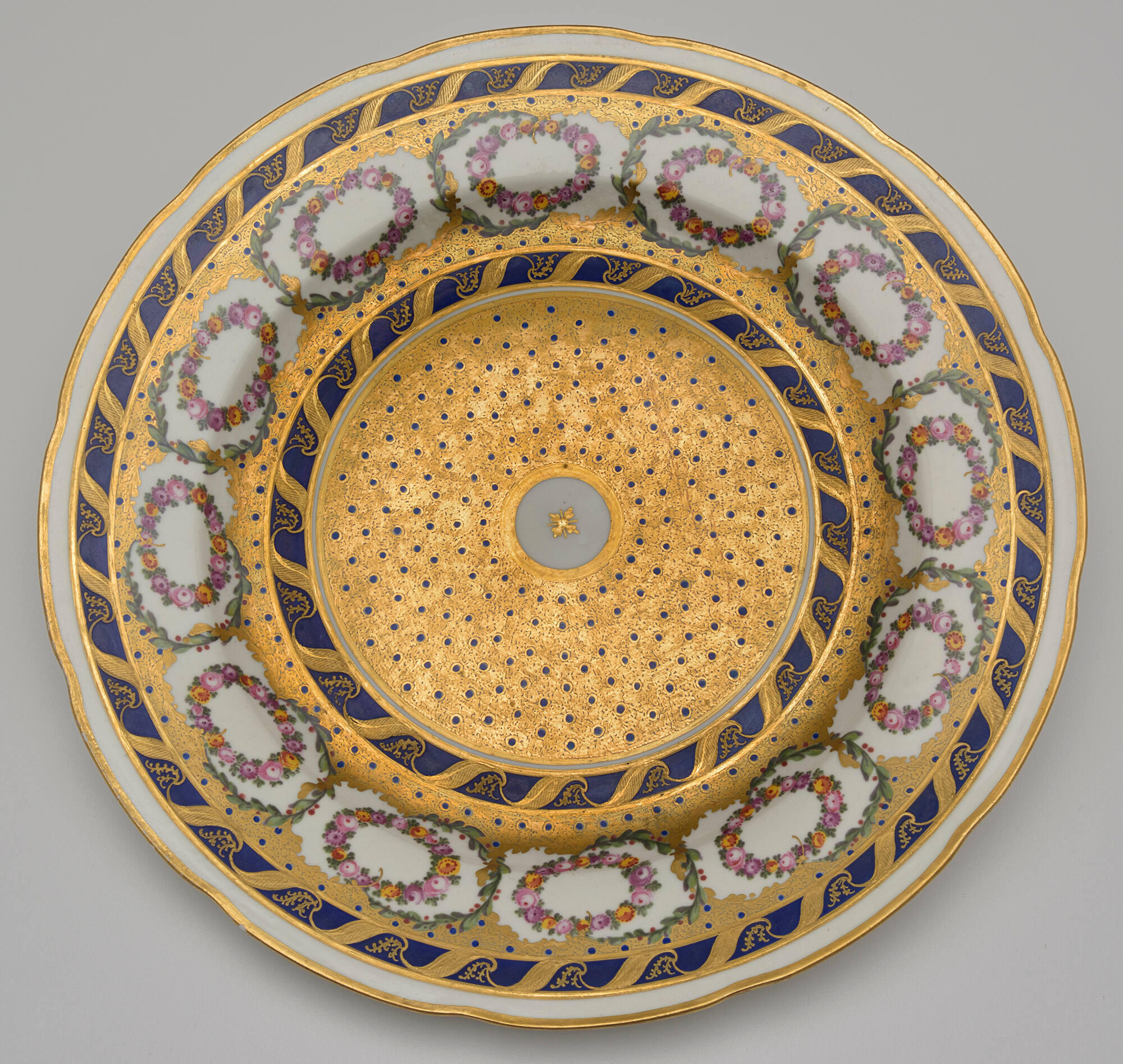 A round, elaborately decorated plate.