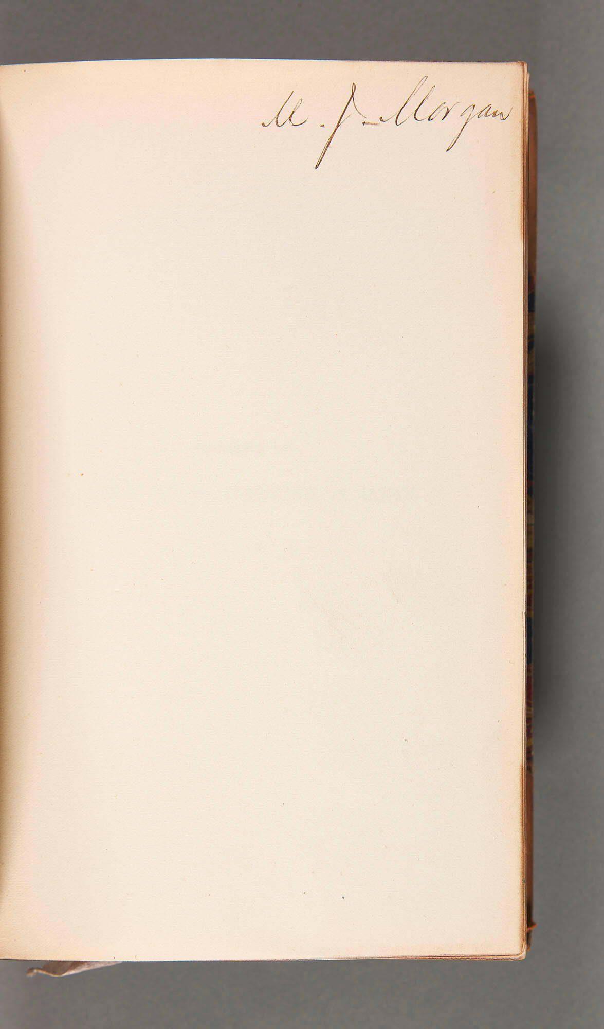 Book page with M J Morgan signed in ink in the upper right hand corner