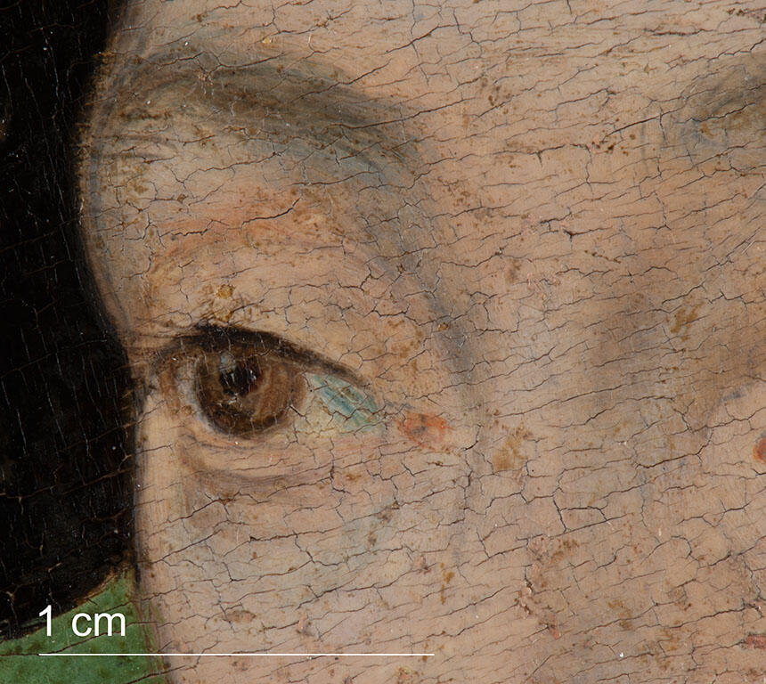 Close up image showcasing pale blue underdrawing, sheer brown brushstrokes to create the sitter’s eyelashes, iris, and eyebrow; and thin paint of the fleshtones.