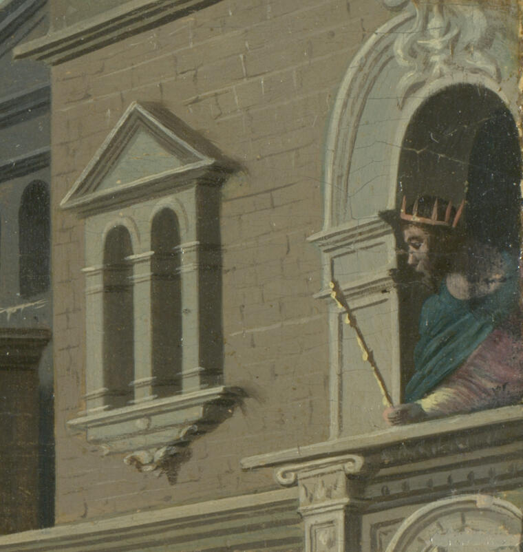 A man wearing a blue cloak and a gold crown looks out of a castle window.