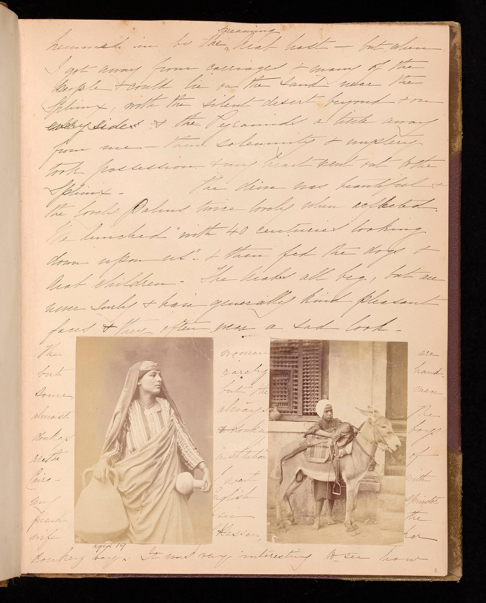 Page from an album with handwritten text and two photographs of people, one a woman holding ceramic vessels, the other a man with a donkey outside a building.