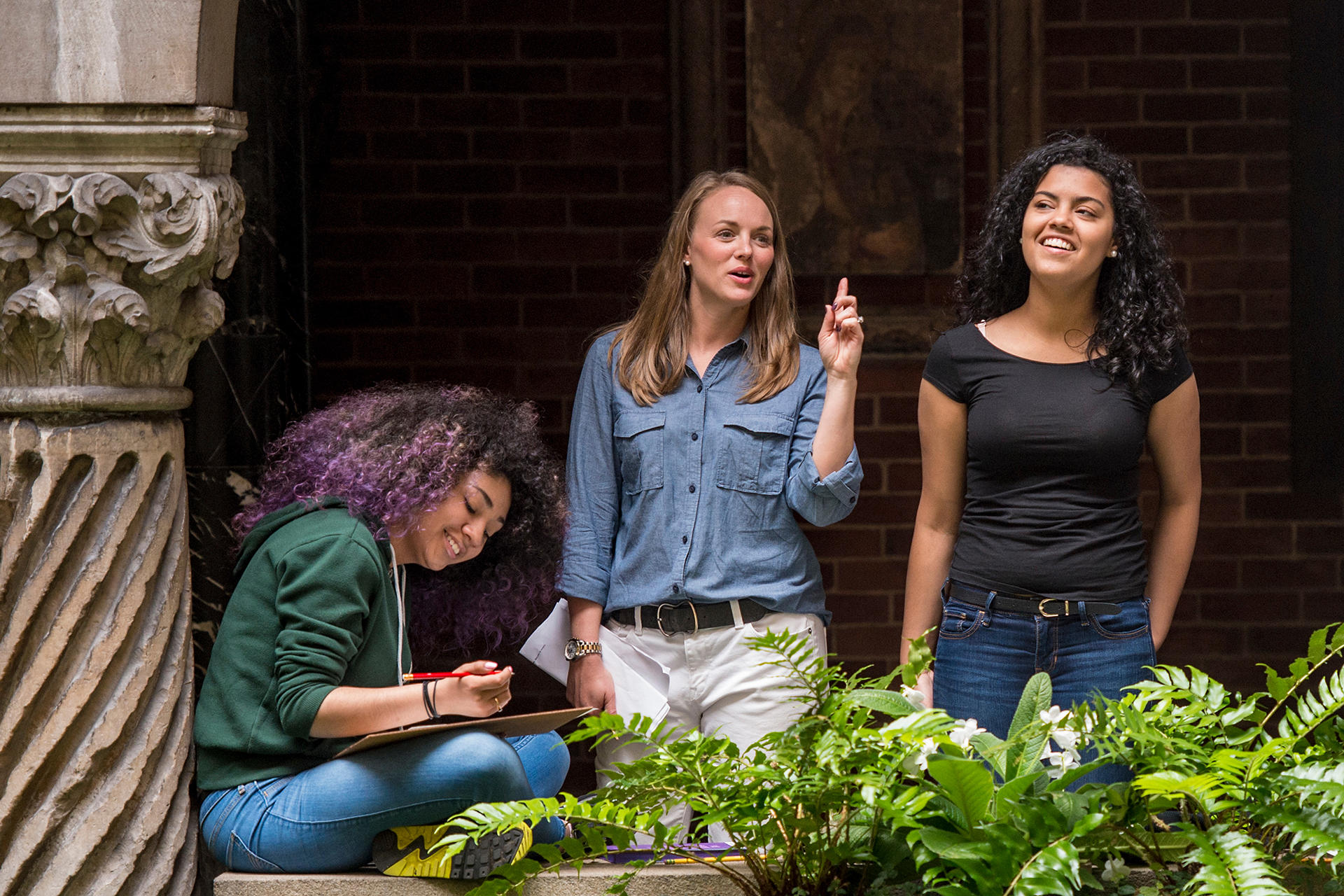 University students during a tour of the Gardner Museum courtyard.