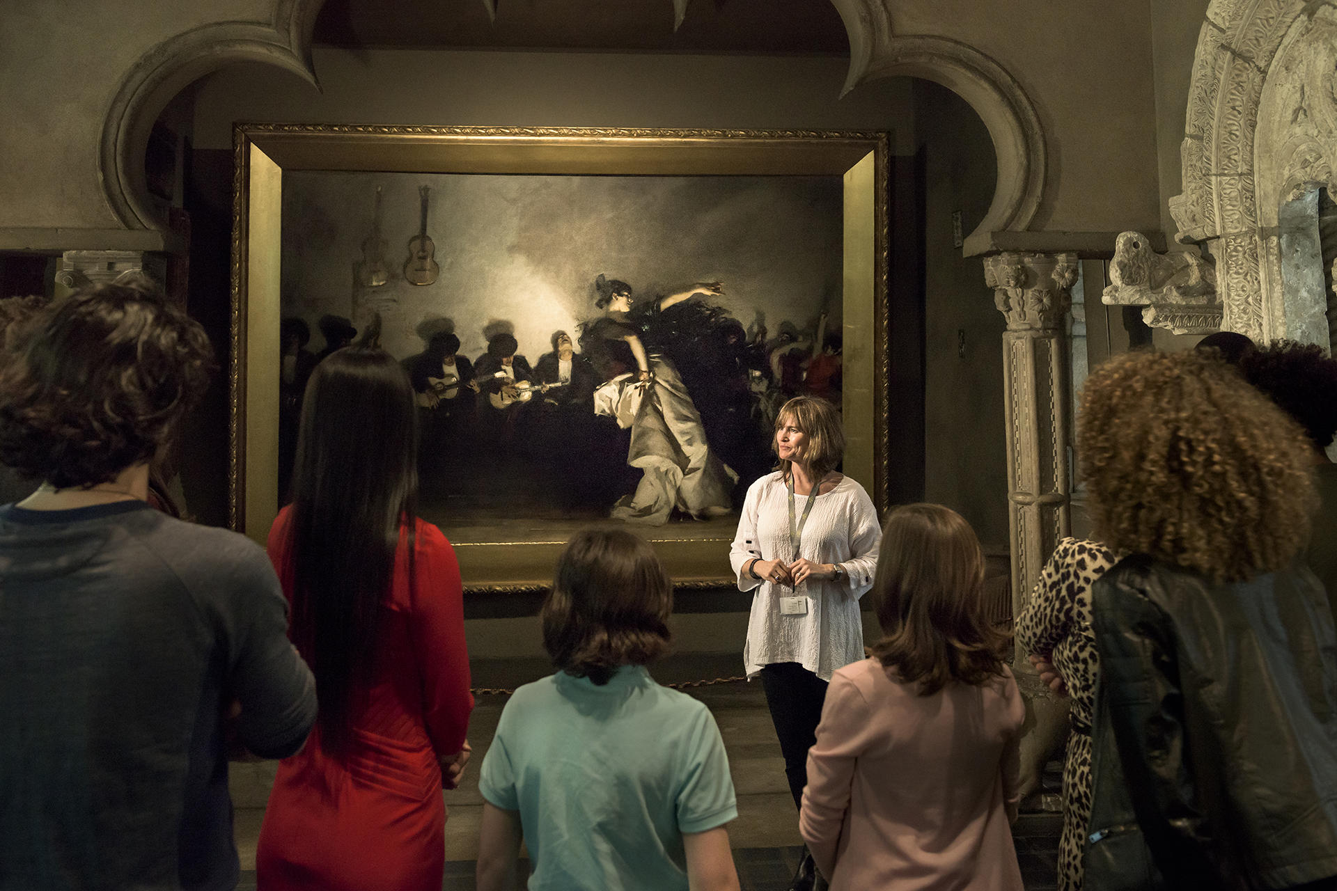 A Museum Teacher leads a tour in the historic Palace