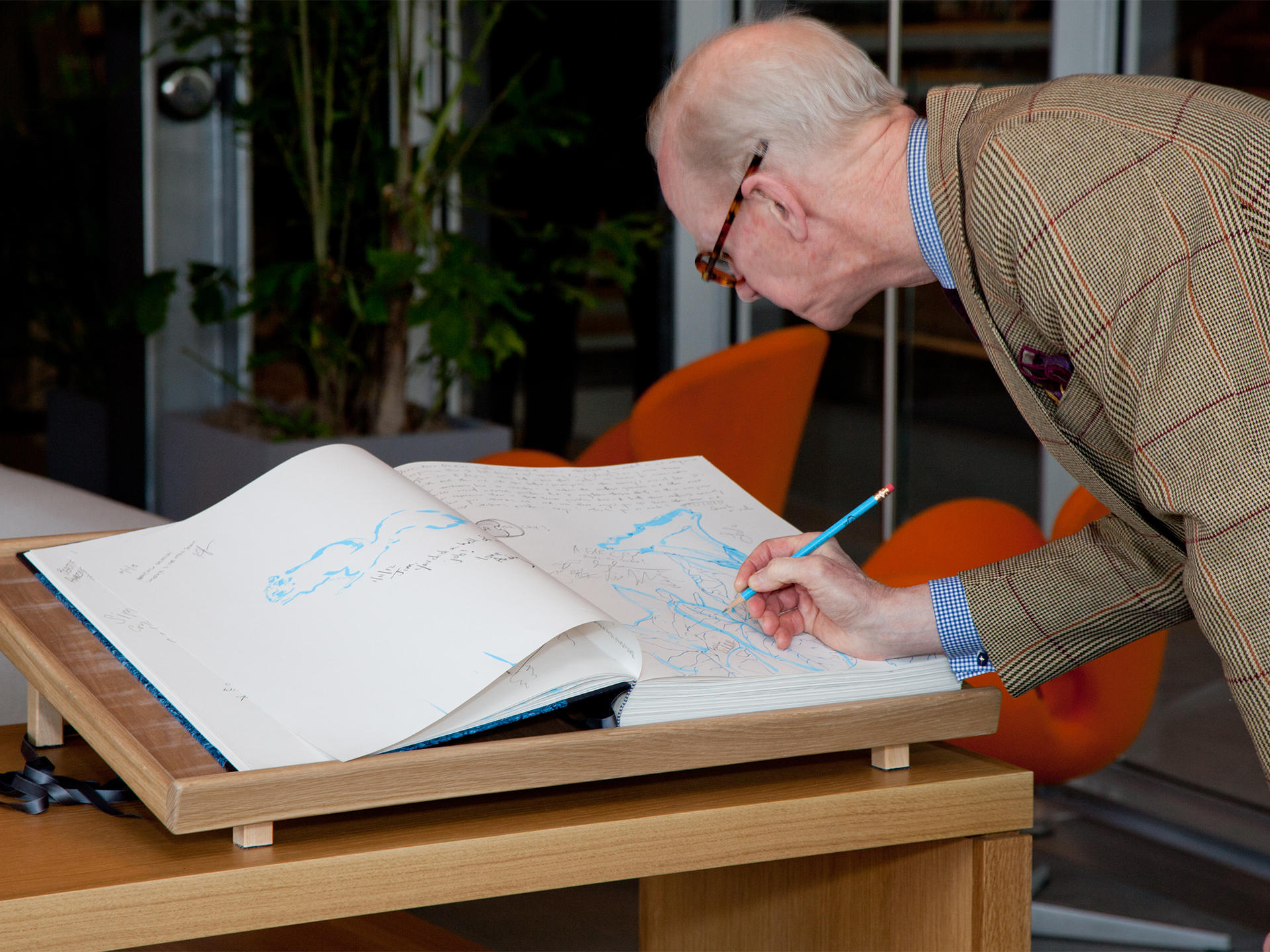 Guests signing in to the Libro Azzurro book designed by Arienti, 2012