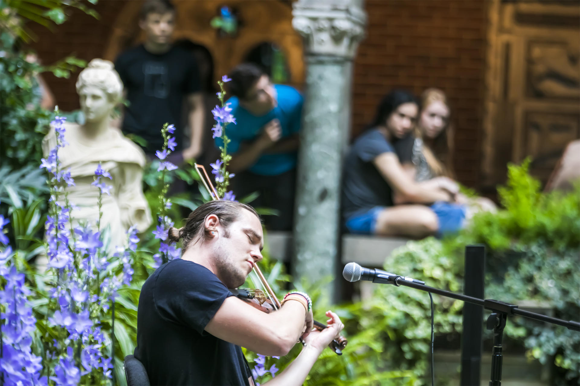 Josh Knowles performing in the Courtyard. Photo by  Matt Teuten.