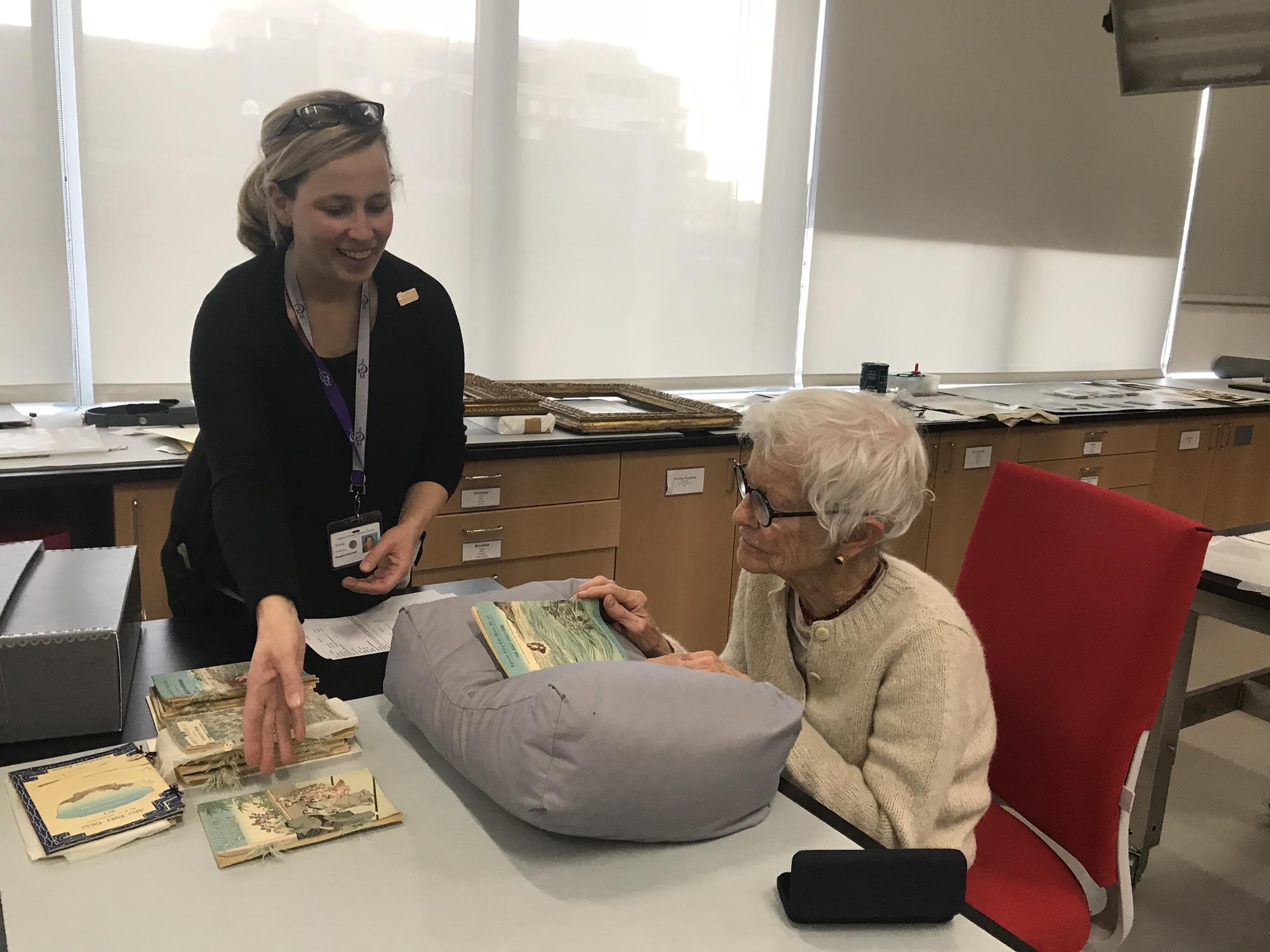 Joan Jonas studying Japanese Fairytale books, 2017.