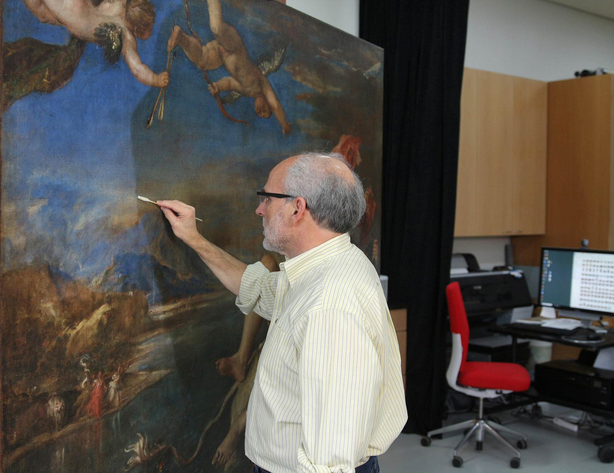 Chief Paintings and Research Conservator Gianfranco Pocobene removes the varnish from Europa.