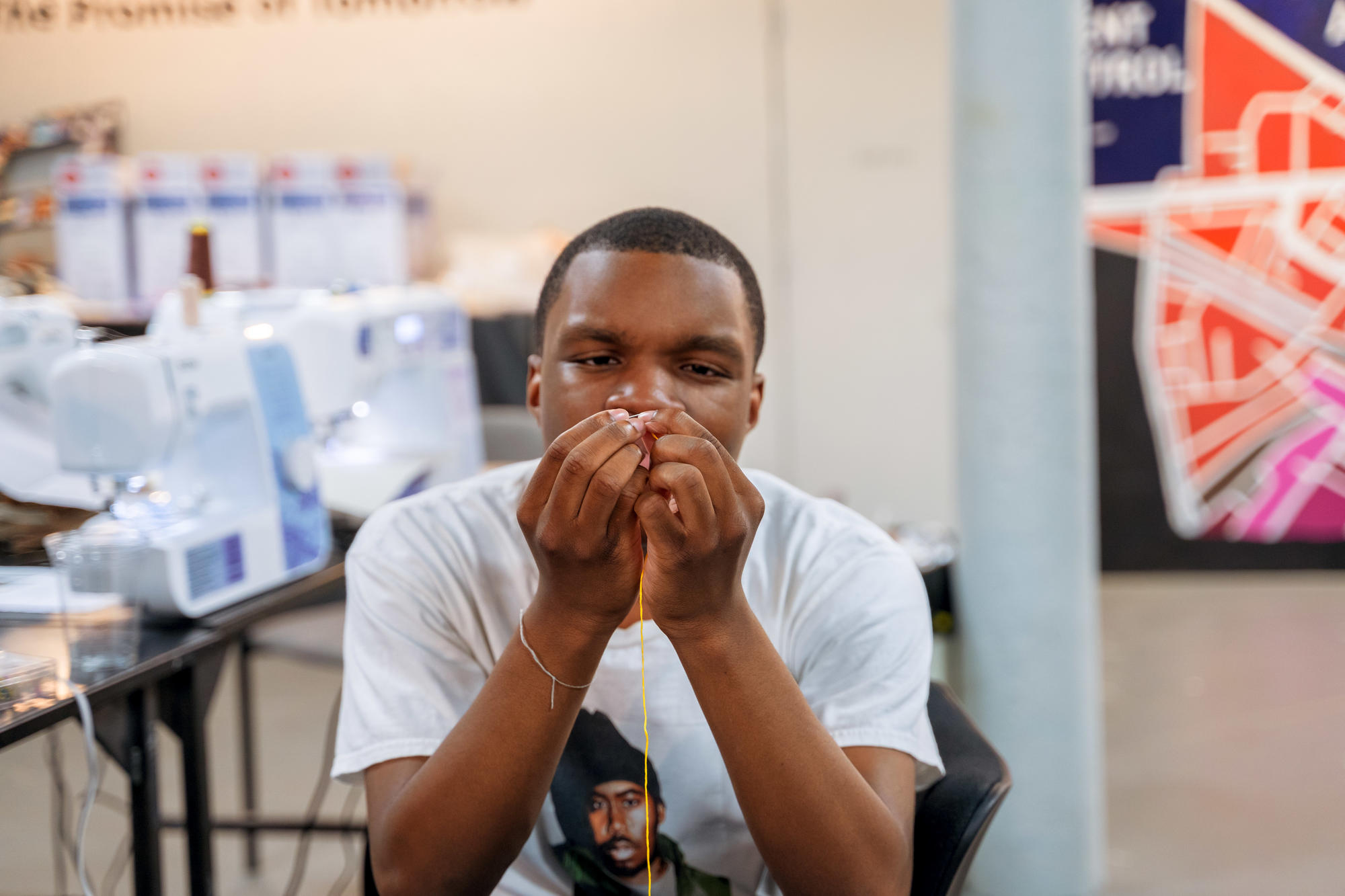 An Urbano Project student works on their Map This garment.