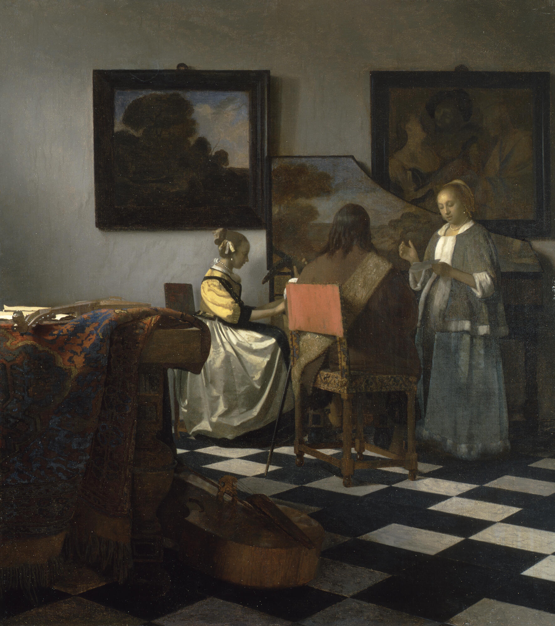 Three figures in 17th-century garments clustered around a piano; the central male figure sits in a pink-backed chair. 
