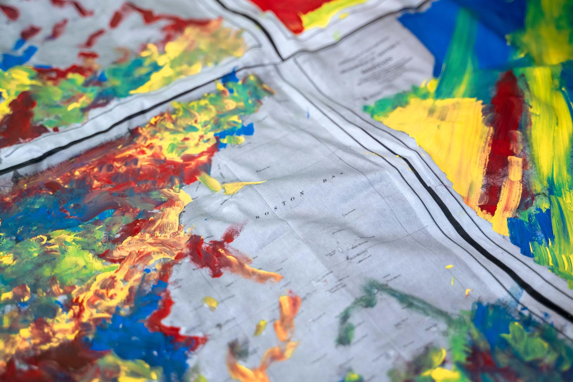 A close-up shot of a rainbow map-inspired textile created by Urbano Project students. 