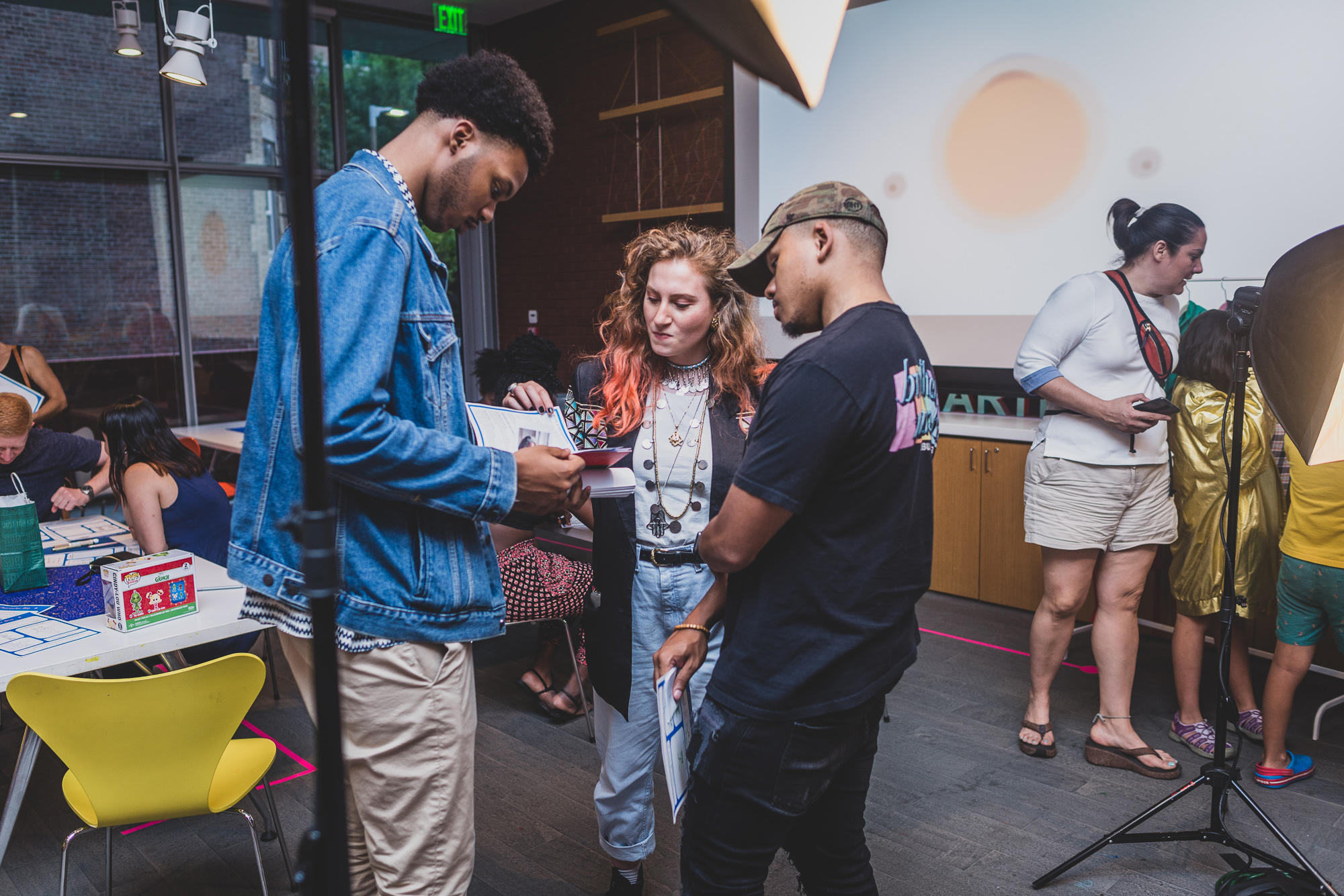 Visitors talk with Polly Thayer Starr Visiting Studio Artist and Neighborhood Salon Luminary Feda Eid during a 2019 Neighborhood Night.