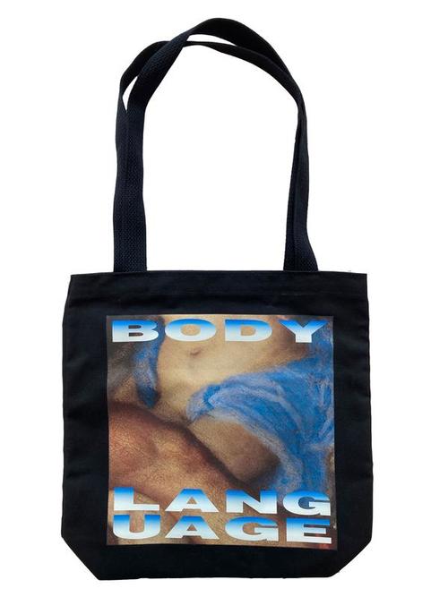 A tote bag with the words Body Language and a close up of "Body Language" by Barbara Krueger.